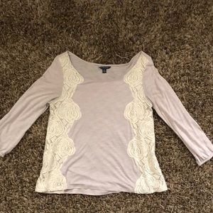 3/4 sleeve shirt with lace detail on sides.